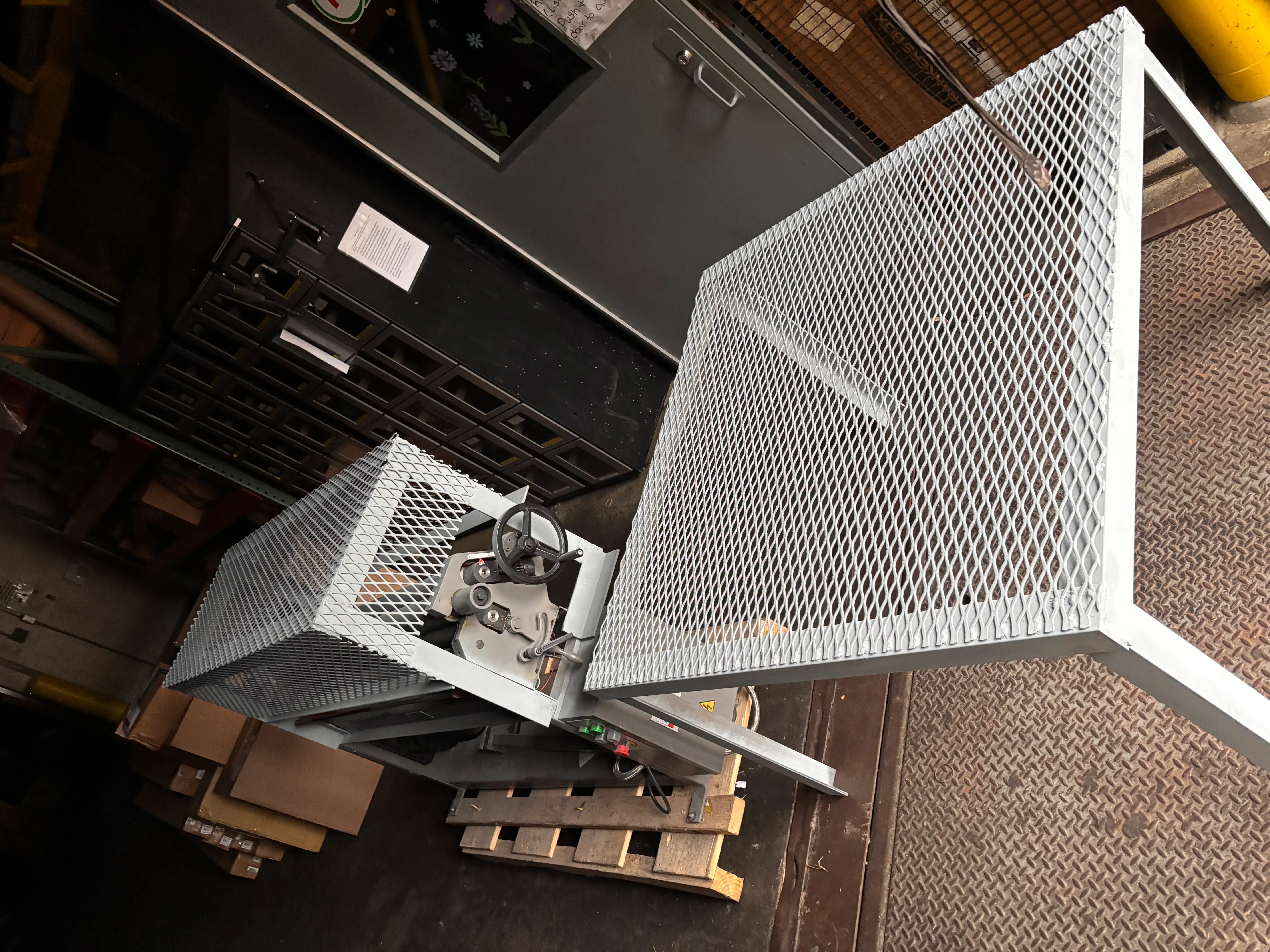 White powder-coated steel frame with expanded metal mesh panels and hinged access door